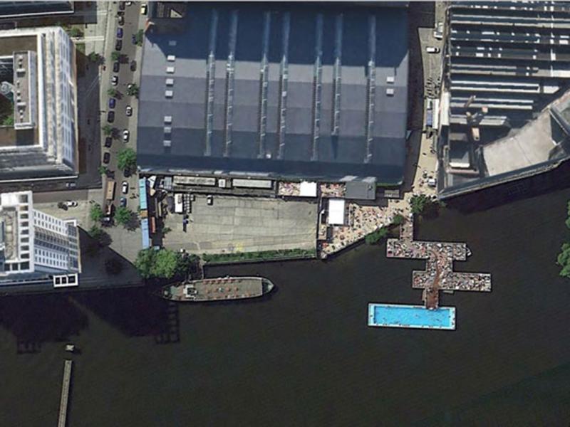 A Huge Swimming Pool Near the Water 50